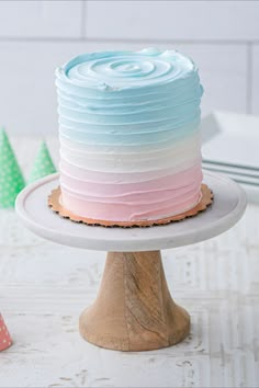 a multi - colored cake sitting on top of a white plate