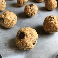 chocolate chip cookies and oatmeal balls on a baking sheet