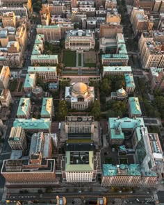 an aerial view of a city with lots of tall buildings