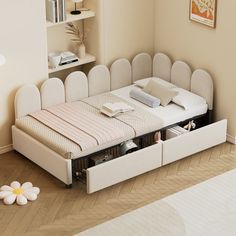 a bed that is sitting in the middle of a room next to a book shelf