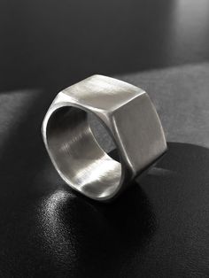 "A unisex industrial hexagonal stainless steel ring made of a real hardware nut. A wide, chunky, geometric band with an edge to it. Perfectly smooth inside. The ring is 0.5\" (1.3 cm) wide. US sizes available for this width are 6 - 10.5. Sizes 11 - 14 are available here: https://www.etsy.com/listing/155354355 Sizes 4.5 - 5.5 are available here: https://www.etsy.com/listing/464852845 Keep in mind that the smaller the ring size (in this particular size range), the thicker the ring sides, and vise Metal Jewelry Making, Metal Jewellery, Flagstaff Az, Metalsmithing Jewelry, Hex Nut, How To Make Rings, Diy Rings, Stainless Steel Ring, Welding Art