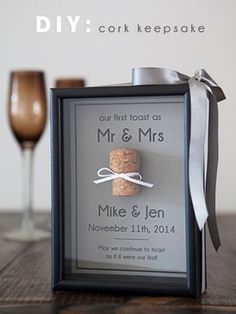 a photo frame with a wine cork tied to it