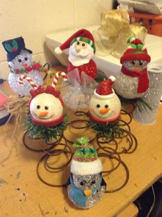 snowmen and santa hats are sitting on the table