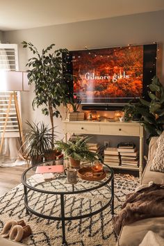 a living room filled with furniture and a flat screen tv