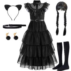 a black dress with long hair and accessories