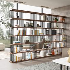 a living room filled with lots of furniture and bookshelves next to a window