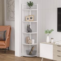 a living room with a couch, chair and book shelf in it's corner