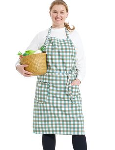 a woman in an apron holding a basket