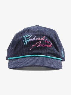 a blue hat with the words, we are proud written on it in pink and green