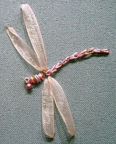 a close up of a dragonfly on a blue surface