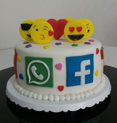 a decorated cake with two smiley faces on top