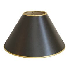 a black lamp shade with gold trim on the bottom is shown in front of a white background