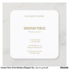 a white business card with gold foil on it