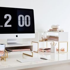 an apple computer sitting on top of a desk