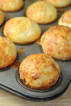 muffins are sitting on a baking tray ready to be baked in the oven