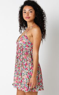 Introducing the Viviane Pink Floral Babydoll Mini Dress. Embrace your inner flower child with this playful and flirty dress. Perfect for any occasion, its vibrant floral pattern and babydoll silhouette will have you feeling like a true bohemian. Let the bold and beautiful floral print of this babydoll dress in pink, white, green, and blue take you on a stylish adventure! With a flirty V-neckline and cami straps, it's the perfect mix of cute and chic. Perfect for your summer adventures, this dres Babydoll Mini Dress, Boho Pink, Flirty Dresses, Backless Mini Dress, Pink Floral Dress, Bold And Beautiful, Dress Boho, Summer Adventures, Floral Dress Summer