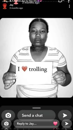 a woman holding up a sign with the word i love trolling in front of her