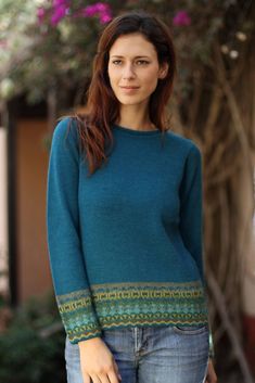 The ancient glyphs of the Inca Empire inspire Fernando Cano to design this elegant turquoise green sweater. He knits it with alpaca wool featuring abstract glyphs on the cuffs and waist. Alpaca wool has been prized in the Andean region for centuries thanks to its warm and light weight fleece. Alpaca Wool Sweater, Alpaca Sweater, Plus Size Vintage, Sleeves Clothing, Round Neck Sweaters, Alpaca Wool, Green Sweater, Wool Sweater, Sleeve Sweater