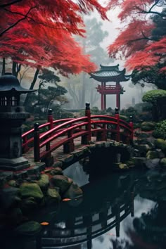 a red bridge over a small pond surrounded by rocks and trees with red leaves on it