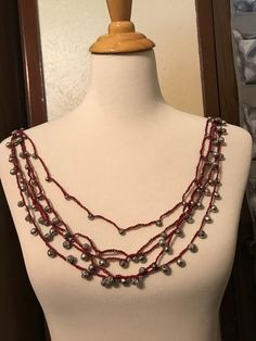 This was made with hand dyed crochet cotton and round silver tone rose beads. There is no clasp and it the tabs on the side a placed on the shoulders it will drape as pictured. *Not responsible for VAT  Free shipping is for the continental US Red Garnet Beaded Necklaces With Round Beads, Red Hand-strung Oval Beaded Necklaces, Elegant Red Garnet Beaded Necklaces, Luxury Hand-strung Red Beaded Necklace, Vintage Red Hand-strung Beaded Necklaces, Bead Crochet, Silver Necklaces, Hand Dyeing, Silver Tone