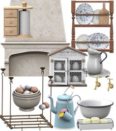 an assortment of kitchen items including dishes, cups and utensils in front of a fireplace