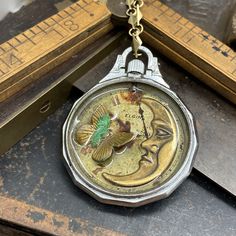 Luna, Shadow Box Pendant  #upcycled #victorianmagpie #Steampunk #handmadejewelry #timlesstreasure #watchjewelry #newfromold #steampunkjewelry #neovictorian #industrialdesign Pocket Watch Necklace, Steam Punk Jewelry, Vintage Timepiece, Neo Victorian, Pocket Watch Antique, Vintage Pocket Watch, Antique Watches, Watch Parts, Flying Monkey