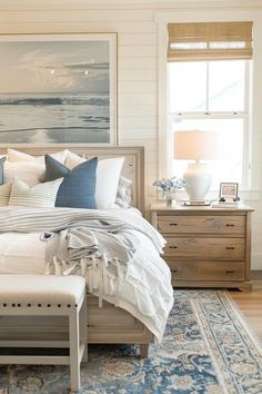 a bedroom with white walls and blue accents