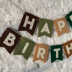 a happy birthday banner hanging on a wall