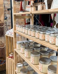 many jars are on shelves in a room