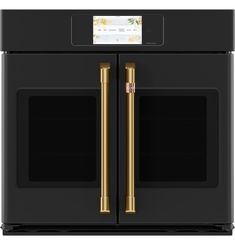 the double oven is black with gold handles and two doors, both side by side