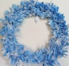 a blue and white wreath hanging on the wall