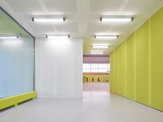 an empty room with yellow and white walls