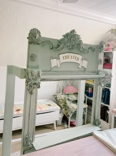 a mirror that is in the middle of a room with a chair and bed behind it