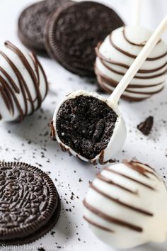 chocolate covered oreo pops with white and brown icing