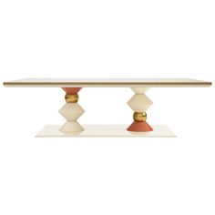 a white table with two red and gold pedestals on the top, against a white background