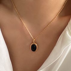 "Elevate your style with our exquisite Oval Black Onyx Pendant/Charm - a versatile Black Onyx necklace designed to effortlessly combine elegance and sophistication. This stunning piece offers three chain options: the edgy Satellite Chain, the timeless Classic Link Chain, or the elegant Pearls Chain. Whether you prefer a Minimalist, Dainty, or classic look, this pendant accommodates various styles, making it a true fashion chameleon Searching for the perfect gift for her? Look no further. This Oval Black Onyx Pendant/Charm combines different styles in one elegant piece, making it an ideal gift choice. Whether you're treating yourself or surprising a loved one, this necklace is sure to impress. DETAILED DESCRIPTION// Material: 925 sterling silver filled 18k gold Stone: natural black onyx Pen Luxury Onyx Jewelry For Women, Luxury Elegant Onyx Necklace, Luxury Timeless Onyx Jewelry, Elegant Black Necklaces With Adjustable Chain, Black Pendant Jewelry With Adjustable Chain, Black Pendant Chain Necklace Gift, Black Enamel Oval Necklace As Gift, Elegant Black Clavicle Chain Necklace, Black Enamel Oval Necklace For Gift