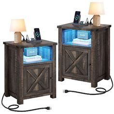 two wooden nightstands with lights on each side and a phone charging in the middle