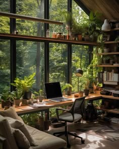 a home office with large windows and lots of plants