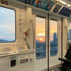 the inside of a train car with windows on both sides