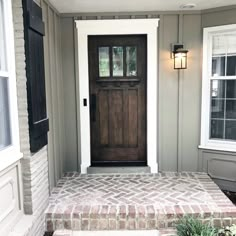 the front door of a house with steps leading up to it