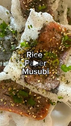 rice paper musubi on a white plate topped with sesame seeds and seasoning