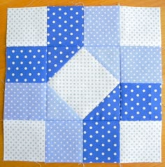 the block is made up of blue and white polka dot fabric, which has been stitched together