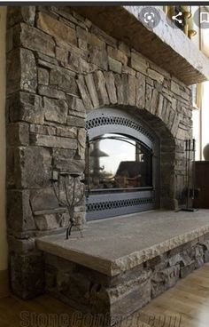 a large stone fireplace in a living room