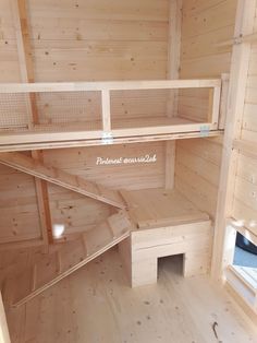 the inside of a wooden building with shelves