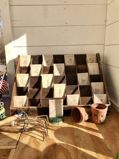 a wooden table topped with lots of pots and pans on top of it's side