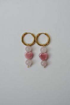 Rose Quartz & Pink Heart Earrings are made with REAL Rose Quartz beads and porcelain hearts. Rose Quartz is known to be a stone that attracts love! So these earrings are filled with extra love. Color - Pink & Gold Material - Rose Quartz, Porcelain, & Stainless Steel Measurements - Hoop 0.6 Inches, 1.75 Inch Drop Heart Earrings Diy, Silver Gold Necklace, Hearts Earrings, Pink Heart Earrings, Rose Quartz Pink, Locket Bracelet, Quartz Pink, Real Rose, Rose Quartz Beads