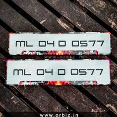 two skis are laying on the ground with numbers printed on them and one is missing