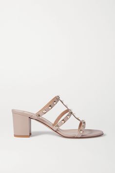 Valentino Garavani's signature 'Rockstud' mules are hand-embellished with gold pyramid hardware that is individually galvanized for enduring shine. Made from smooth leather, this pair has caged straps to frame your feet. The blush hue works particularly well with faded denim.  Shown here with: [Current/Elliott Jeans id1092838], [Stella McCartney Top id1208809], [Gucci Shoulder bag id1203242]. Valentino Boots, Valentino Sunglasses, Valentino Garavani Shoes, Black Slippers, Gucci Shoulder Bag, Valentino Rockstud, Valentino Shoes, Black Leather Tote, Faded Denim