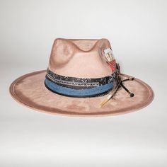 This USA-made, handmade cowgirl hat is a stunning addition to any outfit! Made with high-quality fabrics and trims, it's sure to make a statement. Own the Wild West with this quirky, fun accessory. Paper Lace, Instagram Help, Cowgirl Hat, The Wild West, Cowgirl Hats, Hat Making, Wild West, The Wild, Feathers