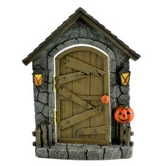 a halloween scene with an open door and pumpkins